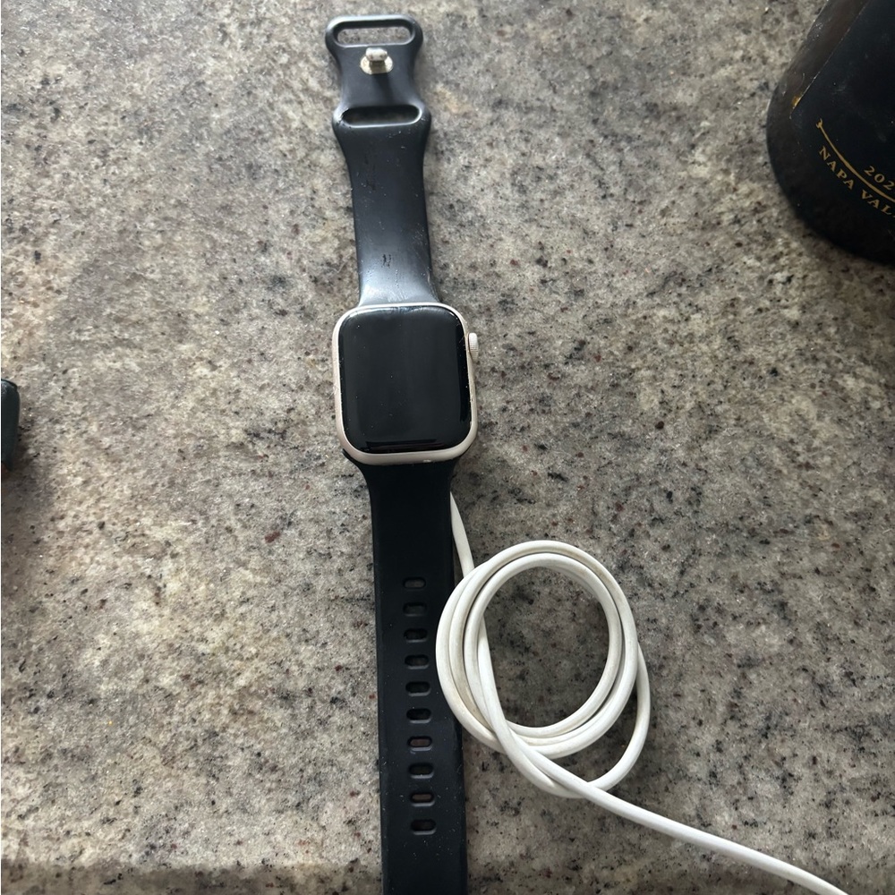 Black Apple Watch Series 7 (GPS + cellular) with Charger cable
